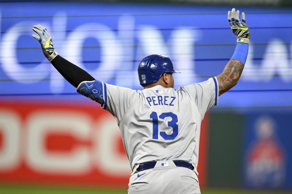 Kansas City Royals' Salvador Perez celebrates hitting a grand slam during the sixth inning of the second game of a baseball doubleheader against the Cleveland Guardians, Monday, Aug. 26, 2024, in Cleveland. (AP Photo/Nick Cammett)