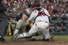 aSan Diego Padres' Bryce Johnson, left, is tagged out at home by St. Louis Cardinals catcher Ivan Herrera during the eighth inning of a baseball game Monday, Aug. 26, 2024, in St. Louis. (AP Photo/Jeff Roberson)