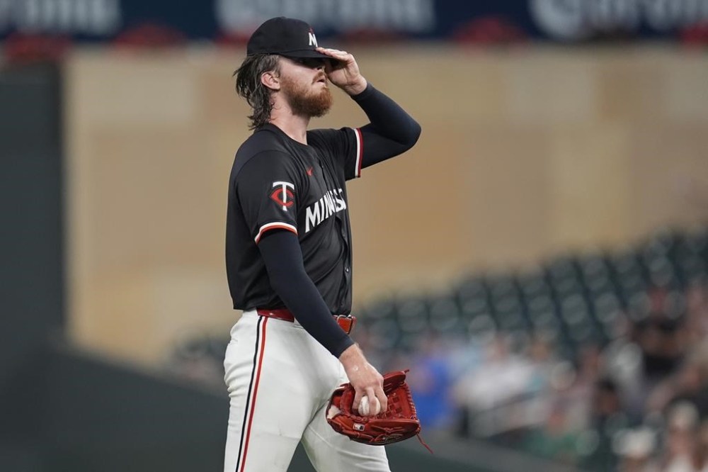 Minnesota Twins starting pitcher Bailey Ober reacts after a three-run home run by Atlanta Braves' Matt Olson during the first inning of a baseball game Monday, Aug. 26, 2024, in Minneapolis. (AP Photo/Abbie Parr)