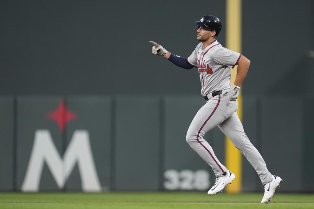 Atlanta Braves' Matt Olson runs the bases after hitting a three-run home run during the first inning of a baseball game against the Minnesota Twins, Monday, Aug. 26, 2024, in Minneapolis. (AP Photo/Abbie Parr)