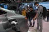 FILE - Visitors look at a Geely Galaxy E8 EV car model during the Auto China 2024 in Beijing on April 28, 2024. (AP Photo/Andy Wong, File)