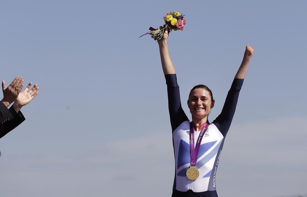 FILE - Sarah Storey of Britain celebrates with her gold medal during the medal ceremony for the women's road cycling individual time trial C1 category the at the 2012 Paralympics games, Wednesday, Sept. 5, 2012, at Brands Hatch motor racing circuit near London.(AP Photo/Alastair Grant, File)