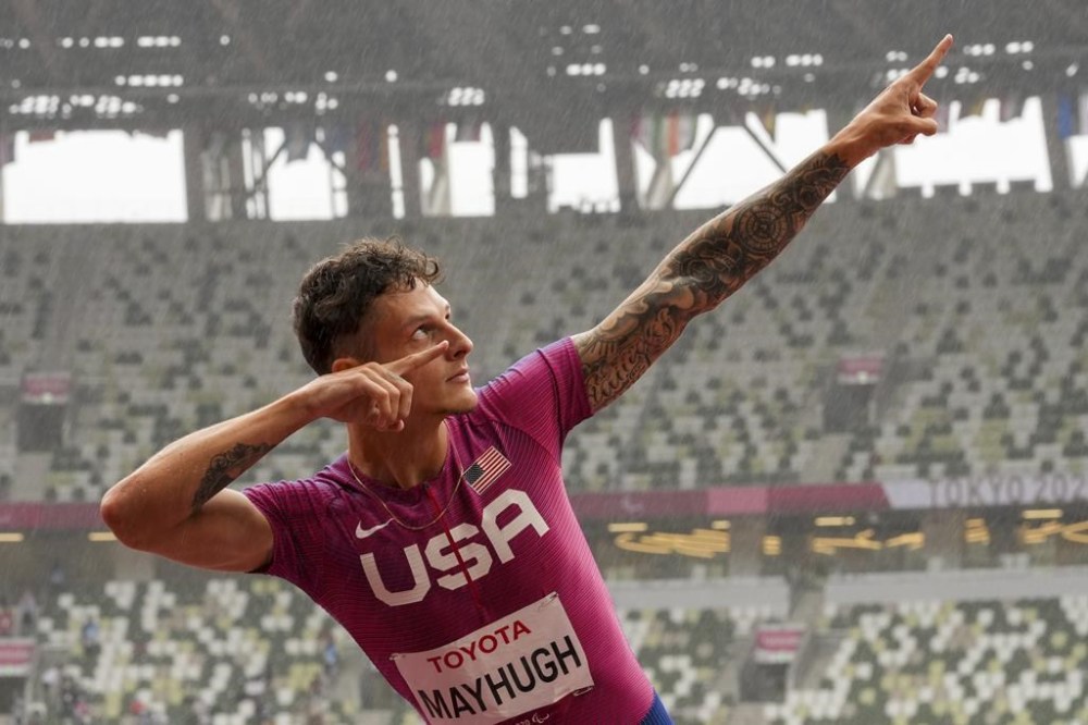 FILE - United States' Nick Mayhugh celebrates after winning the men's T37 200-meters final during the 2020 Paralympics in Tokyo, Saturday, Sept. 4, 2021. (AP Photo/Emilio Morenatti, File)