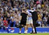 Brighton & Hove Albion's Matt O'Riley is helped from the pitch during an English League Cup second round match between Brighton & Hove Albion and Crawley Town at American Express Stadium in Brighton, England, Tuesday, Aug. 27, 2024. (John Walton/PA via AP)
