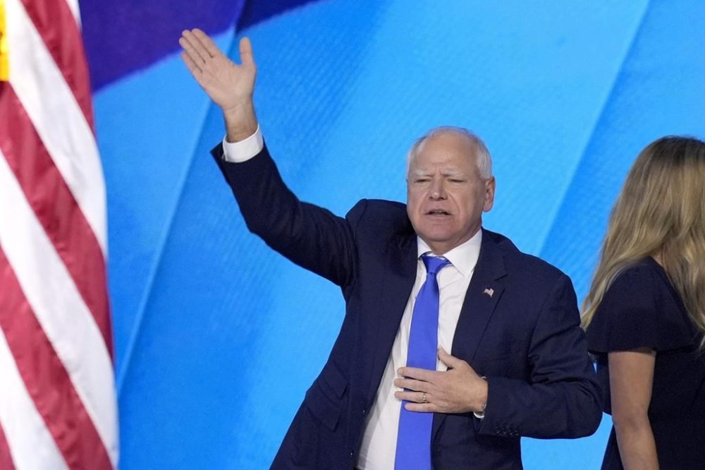 Democratic vice presidential nominee Minnesota Gov. Tim Walz, waves to the crowd after speaking during the Democratic National Convention Wednesday, Aug. 21, 2024, in Chicago. (AP Photo/J. Scott Applewhite)