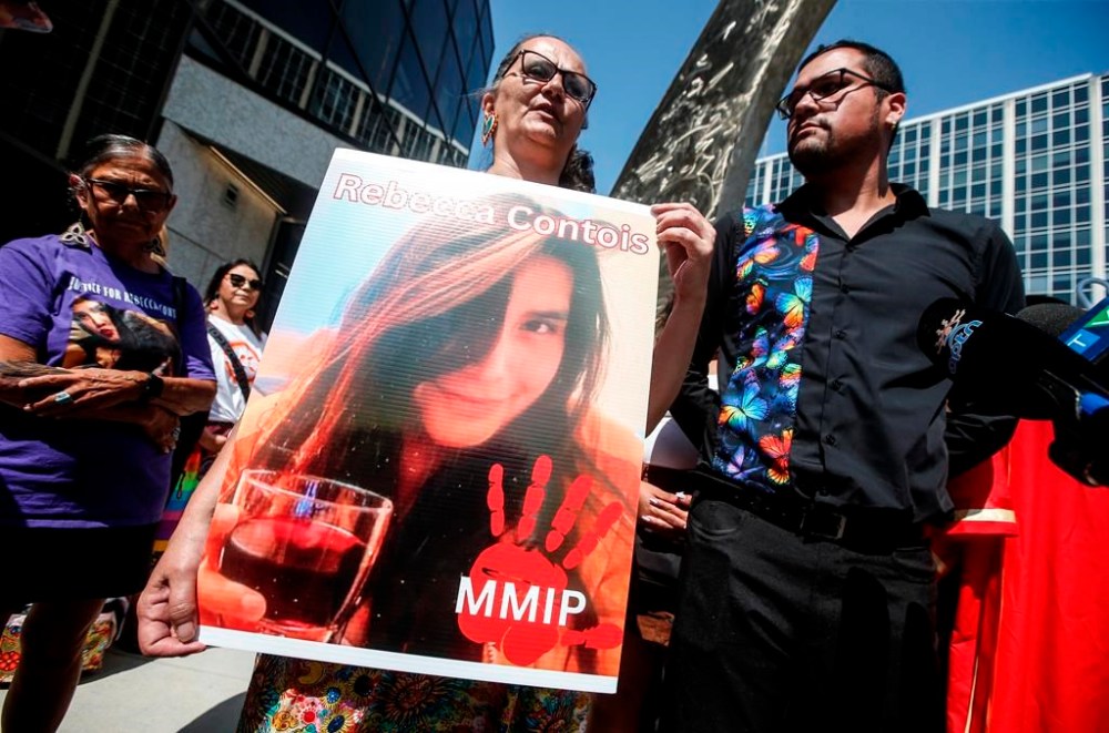 Krystal Fox and Jeremy Contois, brother of Rebecca Contois, express their joy as other families and supporters of four murdered women celebrate outside the Manitoba Law Courts after guilty verdicts of serial killer Jeremy Skibicki are read in a courtroom in Winnipeg on July 11, 2024. THE CANADIAN PRESS/John Woods