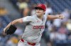 Cincinnati Reds starting pitcher Nick Lodolo delivers during the first inning of a baseball game against the Pittsburgh Pirates Thursday, Aug. 22, 2024, in Pittsburgh. (AP Photo/Matt Freed)