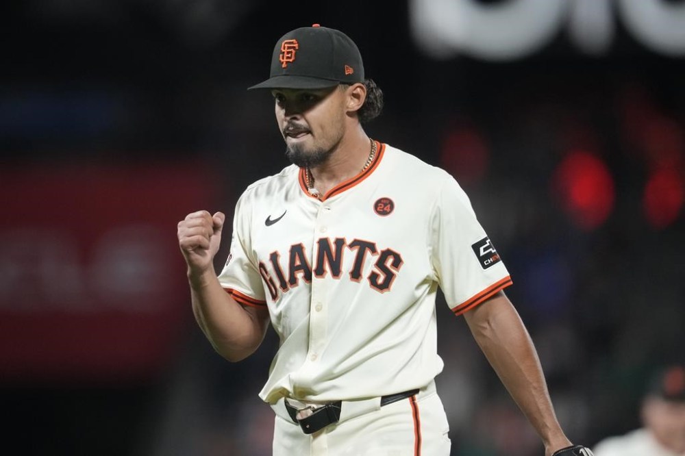 San Francisco Giants pitcher Jordan Hicks celebrates after the Giants defeated the Chicago White Sox in a baseball game in San Francisco, Monday, Aug. 19, 2024. (AP Photo/Jeff Chiu)