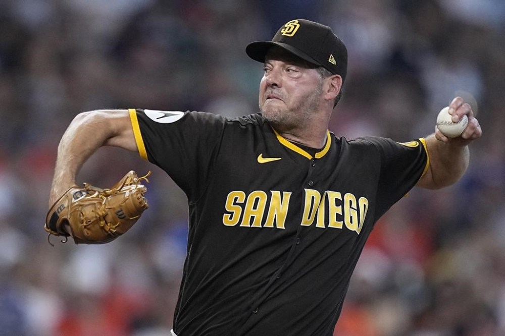FILE - San Diego Padres relief pitcher Rich Hill delivers during the sixth inning of a baseball game against the Houston Astros, Sept. 10, 2023, in Houston. (AP Photo/Kevin M. Cox, File)