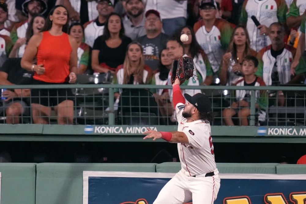 Boston Red Sox outfielder Wilyer Abreu leaps but can't make the catch on a solo home run by Toronto Blue Jays' Will Wagner during the sixth inning of a baseball game at Fenway Park, Tuesday, Aug. 27, 2024, in Boston. (AP Photo/Charles Krupa)