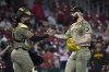 San Diego Padres pitcher Tanner Scott celebrates with catcher Luis Campusano following a 7-5 victory over the St. Louis Cardinals in a baseball game Tuesday, Aug. 27, 2024, in St. Louis. (AP Photo/Jeff Roberson)