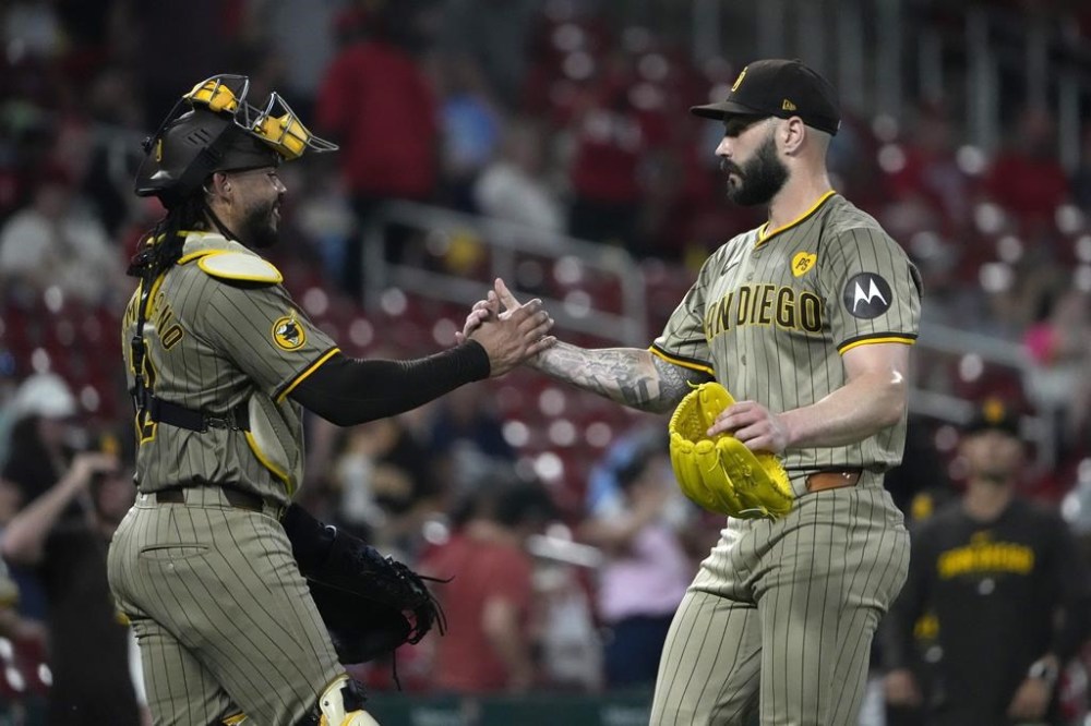 San Diego Padres pitcher Tanner Scott celebrates with catcher Luis Campusano following a 7-5 victory over the St. Louis Cardinals in a baseball game Tuesday, Aug. 27, 2024, in St. Louis. (AP Photo/Jeff Roberson)