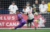 Vancouver Whitecaps' Ryan Gauld (25) scores past Pacific FC defender Juan Quintana during the first half of a Canadian Championship semifinal soccer match, in Vancouver, on Tuesday, Aug. 27, 2024. THE CANADIAN PRESS/Darryl Dyck