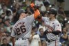 San Francisco Giants' Mike Yastrzemski is congratulated by Matt Chapman after hitting a two-run home run during the seventh inning of a baseball game against the Milwaukee Brewers Tuesday, Aug. 27, 2024, in Milwaukee. (AP Photo/Morry Gash)