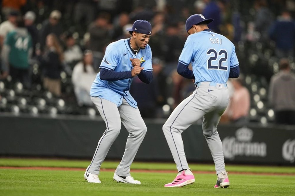 Tampa Bay Rays designated hitter Christopher Morel celebrates with center fielder Jose Siri (22) after 3-2 win against the Seattle Mariners in a baseball game, Tuesday, Aug. 27, 2024, in Seattle. (AP Photo/Lindsey Wasson)