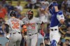 Baltimore Orioles' Ryan O'Hearn, left, celebrates his solo home run with Eloy Jiménez (72) during the second inning of a baseball game against the Los Angeles Dodgers, Tuesday, Aug. 27, 2024, in Los Angeles. (AP Photo/Marcio Jose Sanchez)
