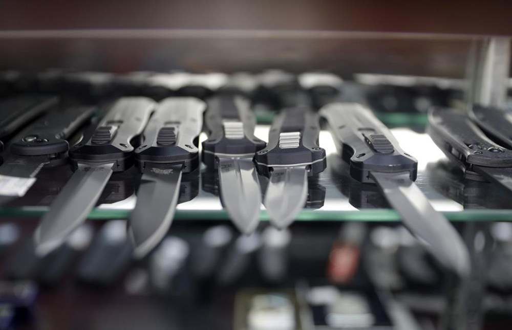 FILE - Automatic knives are on display at Bonds House of Cutlery/Knives & More, Jan. 27, 2017, in Las Vegas. (AP Photo/John Locher, File)