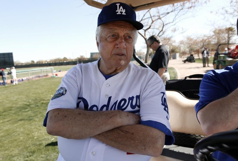 FILE - Los Angeles Dodgers Tommy Lasorda watches practice during spring training baseball in Phoenix, Sunday, Feb. 17, 2013. (AP Photo/Paul Sancya, File)