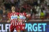 Red Star's Uros Spajic, left, and Red Star's Dalcio Gomes celebrate their victory at the Champions League play-off second leg soccer match between Red Star and Bodo Glimt, at the Rajko Mitic Stadium, in Belgrade, Serbia, Wednesday, Aug. 28, 2024. (AP Photo/Darko Vojinovic)