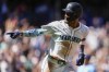 Seattle Mariners' Julio Rodríguez points as he jogs the bases after hitting a two-run home run against the Tampa Bay Rays during the fifth inning of a baseball game, Wednesday, Aug. 28, 2024, in Seattle. (AP Photo/Lindsey Wasson)