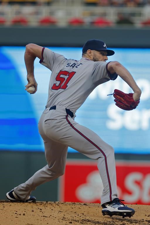Atlanta Braves starting pitcher Chris Sale throws to the Minnesota Twins in the first inning of a baseball game Wednesday, Aug. 28, 2024, in Minneapolis. (AP Photo/Bruce Kluckhohn)