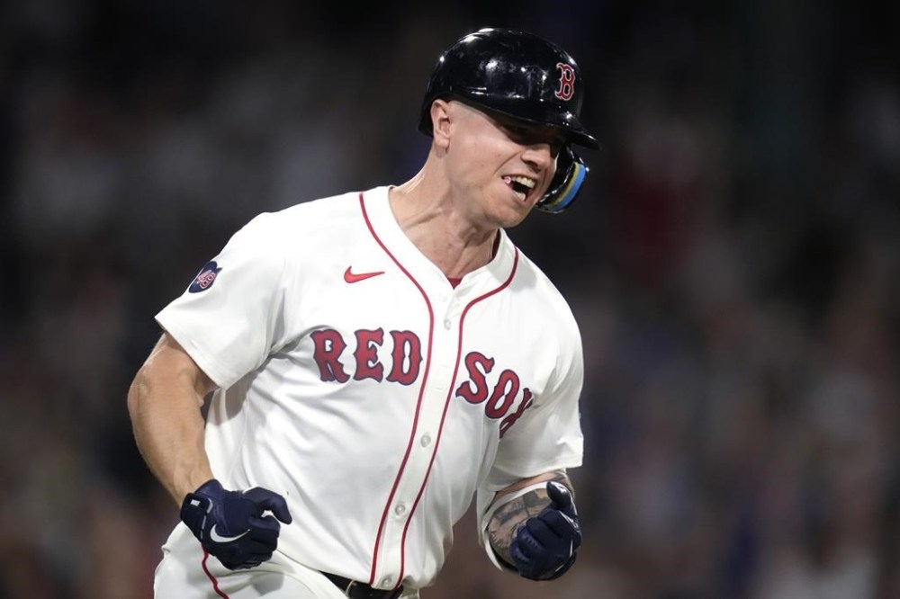 Boston Red Sox's Tyler O'Neill celebrates while rounding the bases on his two-run home run in the eighth inning of a baseball game against the Toronto Blue Jays at Fenway Park, Wednesday, Aug. 28, 2024, in Boston. (AP Photo/Charles Krupa)