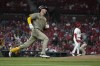 San Diego Padres' Kyle Higashioka, left, rounds the bases after hitting a solo home run off St. Louis Cardinals relief pitcher JoJo Romero, right, during the eighth inning of a baseball game Wednesday, Aug. 28, 2024, in St. Louis. (AP Photo/Jeff Roberson)