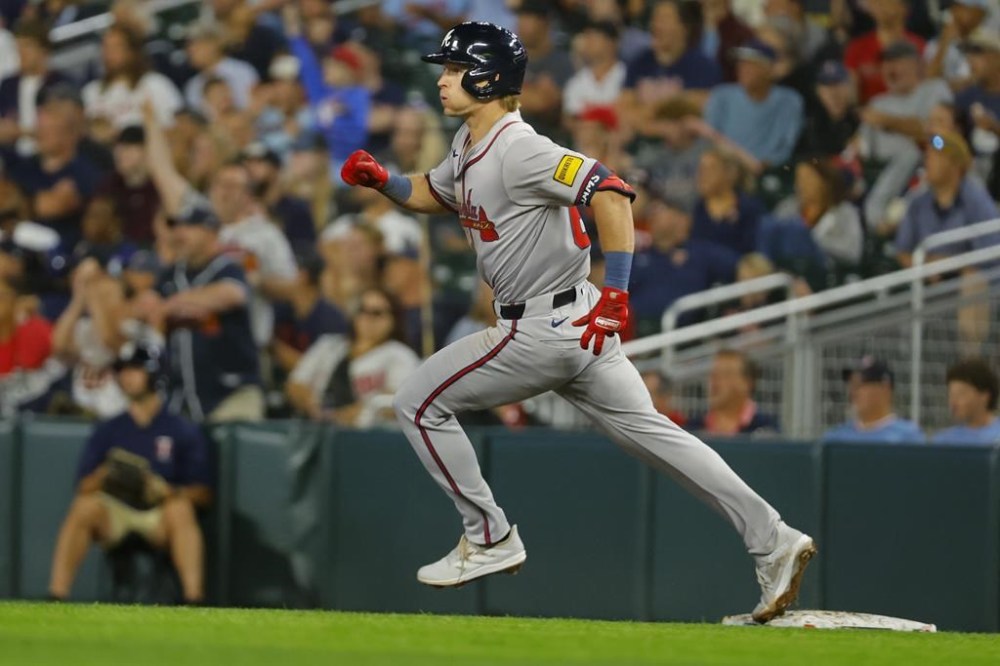 Atlanta Braves' Luke Williams rounds first base on his way to a two-run double against the Minnesota Twins in the seventh inning of a baseball game Wednesday, Aug. 28, 2024, in Minneapolis. (AP Photo/Bruce Kluckhohn)