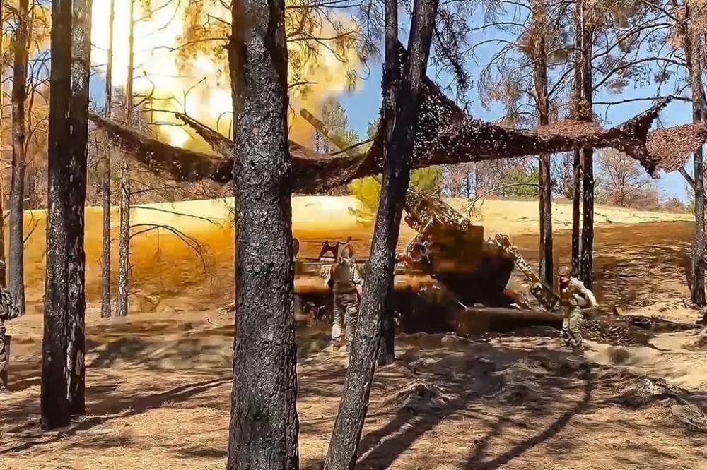 In this photo taken from video released by the Russian Defense Ministry on Tuesday, Aug. 27, 2024, Russian soldiers fires from a 203-mm self-propelled gun 2S7