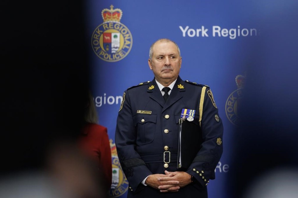 Police say a man wanted for first-degree murder in the death Toronto-area woman has fled Canada. York Regional Police chief Jim MacSween attends a press conference at the York Regional Police Headquarters in Aurora, Ont., Wednesday, Jan. 31, 2024. THE CANADIAN PRESS/Cole Burston