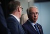 BC Conservative Leader John Rustad, right, pauses to confer with BC United Leader Kevin Falcon while responding to questions during a news conference, in Vancouver, B.C., Wednesday, Aug. 28, 2024. THE CANADIAN PRESS/Darryl Dyck