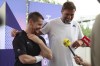 German football manager Jurgen Klopp, right, and para badminton player Wojtek Czyz react as they discuss the results of Czyz's match in Porte La Chapelle Arena during the Paralympic Games on Wednesday, Aug. 28, 2024, in Paris. (AP Photo/Samantha Hurley).