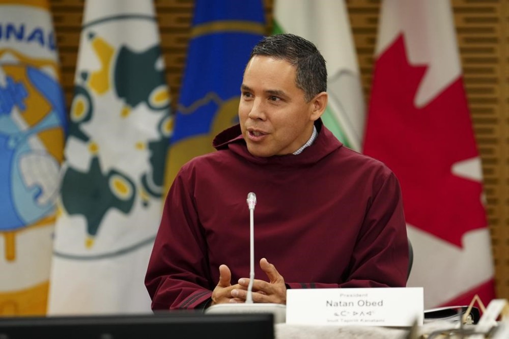 A 16-year-old biennial event aimed at fostering business in the country's Eastern Arctic and northern regions has been cancelled indefinitely as a dispute unfolds between Inuit in Canada and a Labrador group claiming to share their heritage. President of the Inuit Tapiriit Kanatami, Natan Obed, joins Prime Minister Justin Trudeau as they co-chair the meeting of Inuit-Crown Partnership Committee in Ottawa on Thursday, May 9, 2024. THE CANADIAN PRESS/Sean Kilpatrick