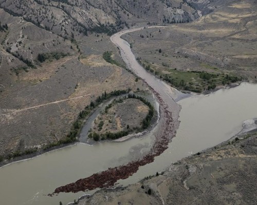 Debris is seen flowing down the Chilcotin River and into the Fraser River following a landslide near Williams Lake, B.C., in a Monday, Aug. 5, 2024, handout photo. THE CANADIAN PRESS/HO-Tsilhqot'in National Government, *MANDATORY CREDIT*