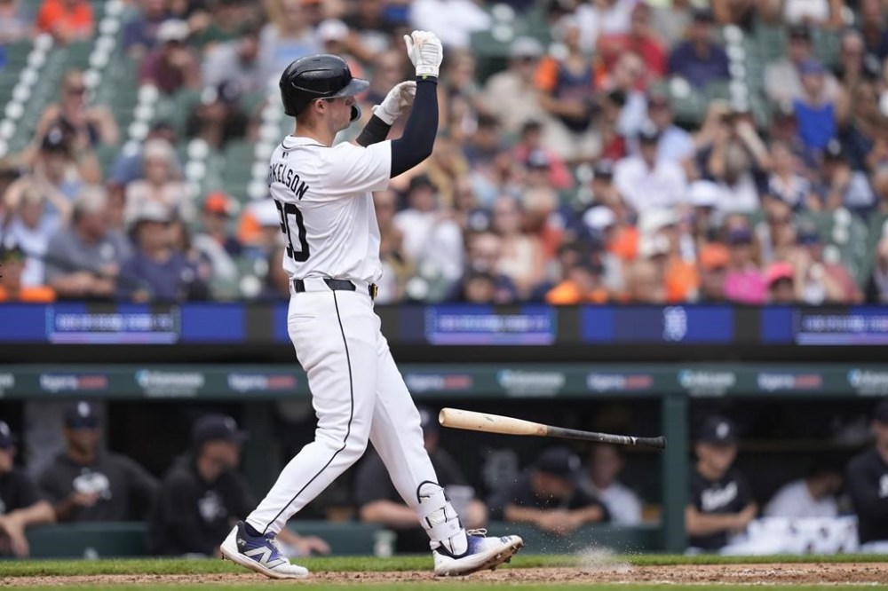Detroit Tigers' Spencer Torkelson tosses his bat after striking out with the bases loaded during the eighth inning of a baseball game, Thursday, Aug. 29, 2024, in Detroit. (AP Photo/Carlos Osorio)