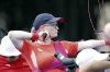 Britain's Jodie Grinham releases an arrow during the Paralympic Games in Paris on Thursday, Aug. 29, 2024. The British archer is competing while pregnant. (AP Photo/Felix Scheyer)