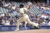 Milwaukee Brewers pitcher Aaron Civale pitches during the first inning of a baseball game against the San Francisco Giants Thursday, Aug. 29, 2024, in Milwaukee. (AP Photo/Kenny Yoo)