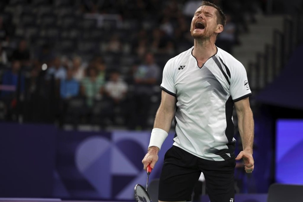 New Zealand's Wojtek Czyz reacts during his para badminton match against Britain's Daniel Bethell in Porte La Chapelle Arena during the Paralympic Games on Wednesday, Aug. 28, 2024, in Paris. (AP Photo/Samantha Hurley).