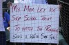A fan holds a sign before a baseball game between the Texas Rangers and the Chicago White Sox in Chicago, Thursday, Aug. 29, 2024. (AP Photo/Nam Y. Huh)