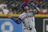New York Mets' Jeff McNeil reacts after hitting a double against the Arizona Diamondbacks in the fifth inning during a baseball game, Thursday, Aug 29, 2024, in Phoenix. (AP Photo/Rick Scuteri)