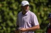 Scottie Scheffler walks off the 11th green during the first round of the Tour Championship golf tournament, Thursday, Aug. 29, 2024, in Atlanta. (AP Photo/Mike Stewart)