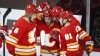 Calgary Flames' Johnny Gaudreau, centre, celebrates his goal with teammates during second period NHL hockey action against the Vancouver Canucks in Calgary, Monday, Jan. 18, 2021. Gaudreau and his brother Matthew were killed when they were hit by a car while riding a bicycle in their home state of New Jersey. THE CANADIAN PRESS/Jeff McIntosh