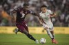 Torino's Duvan Zapata, left, and Venezia's Antonio Candela in action during the Serie A soccer match between Venezia and Torino at the Pier Luigi Penzo Stadium in Venice, Italy, Friday Aug. 30, 2024. (Marco Alpozzi/LaPresse via AP)