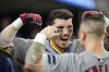 Boston Red Sox's Jarren Duran celebrates his home run in the dugout against the Detroit Tigers in the 10th inning of a baseball game, Friday, Aug. 30, 2024, in Detroit. (AP Photo/Paul Sancya)