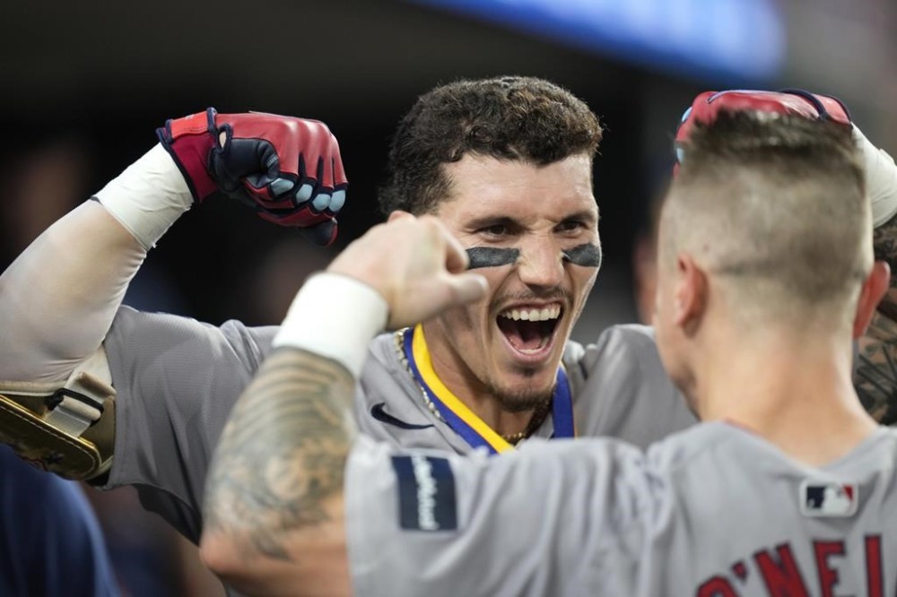 Boston Red Sox's Jarren Duran celebrates his home run in the dugout against the Detroit Tigers in the 10th inning of a baseball game, Friday, Aug. 30, 2024, in Detroit. (AP Photo/Paul Sancya)