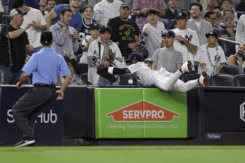 New York Yankees third baseman Jazz Chisholm Jr. can't make a play on a foul ball during the third inning of a baseball game against the St. Louis Cardinals Friday, Aug. 30, 2024, in New York. (AP Photo/Adam Hunger)