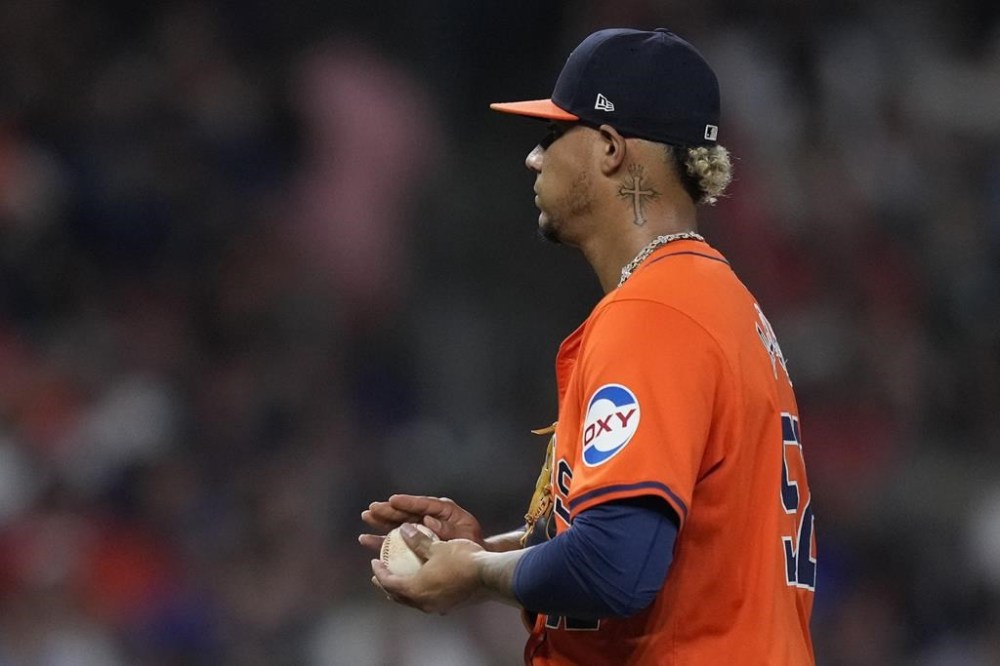 Houston Astros relief pitcher Bryan Abreu walks near the mound after giving up a base hit to Kansas City Royals pinch-hitter Kyle Isbel during the eighth inning of a baseball game Friday, Aug. 30, 2024, in Houston. (AP Photo/Kevin M. Cox)