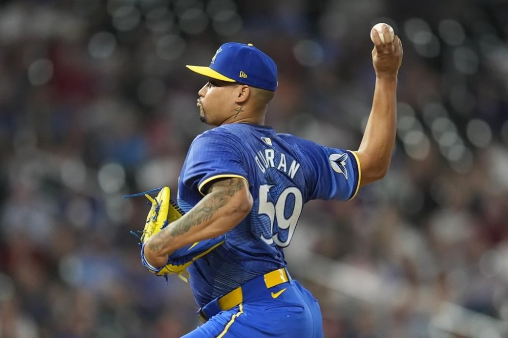 Minnesota Twins relief pitcher Jhoan Duran delivers during the ninth inning of a baseball game against the Toronto Blue Jays, Friday, Aug. 30, 2024, in Minneapolis. (AP Photo/Abbie Parr)
