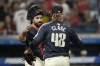 Cleveland Guardians catcher Austin Hedges, left, congratulates relief pitcher Emmanuel Clase (48) after they defeated the Pittsburgh Pirates in a baseball game Friday, Aug. 30, 2024, in Cleveland. (AP Photo/Sue Ogrocki)