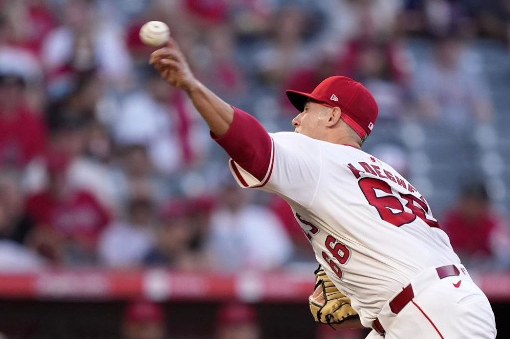 Los Angeles Angels starting pitcher Samuel Aldegheri throws to the plate during the first inning of a baseball game against the Seattle Mariners, Friday, Aug. 30, 2024, in Anaheim, Calif. (AP Photo/Mark J. Terrill)